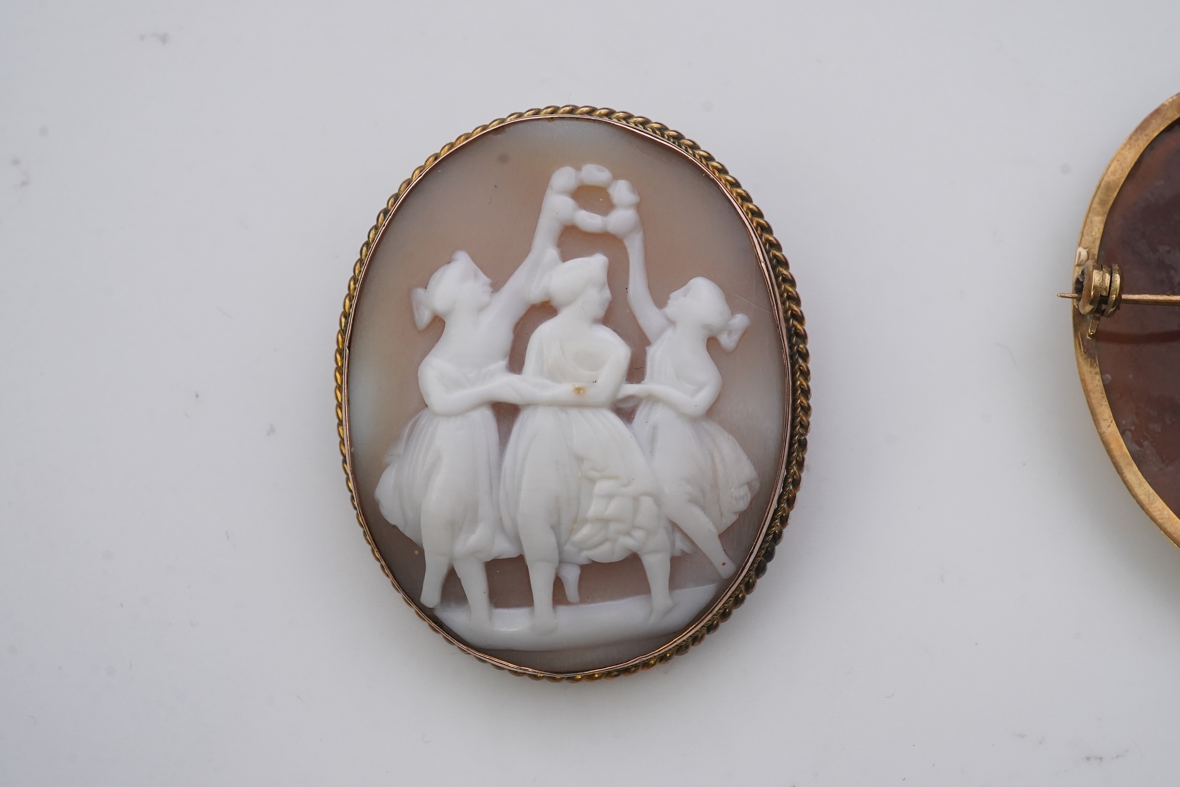 Three shell cameo brooches, 20th century